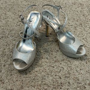 Silver prom shoes.